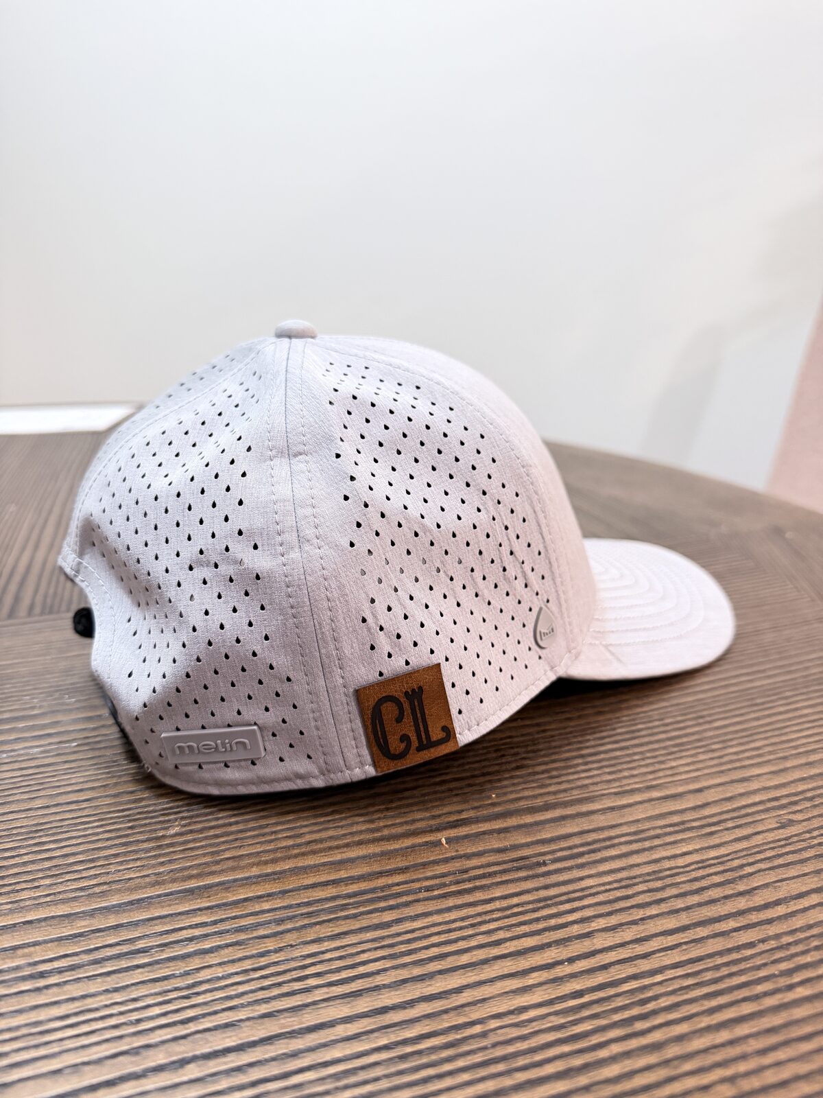 Cap with a custom leather patch applied to the front panel
