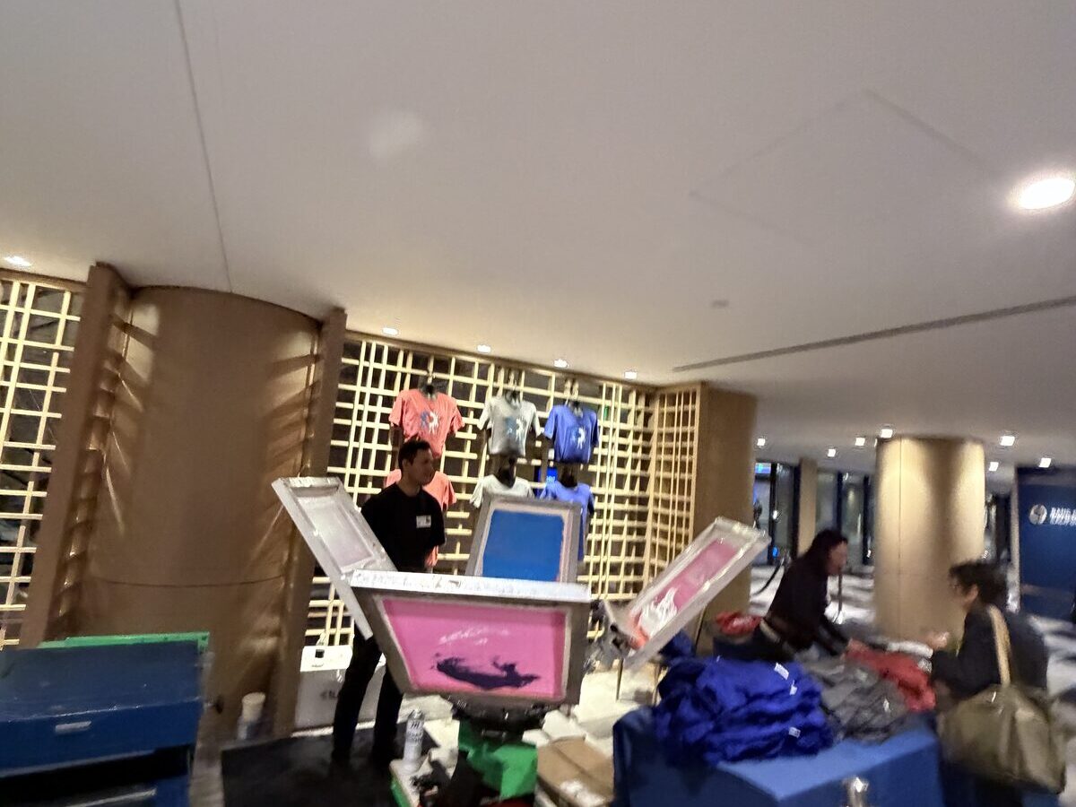 Compact printing station built into a building lobby with equipment on a small table footprint